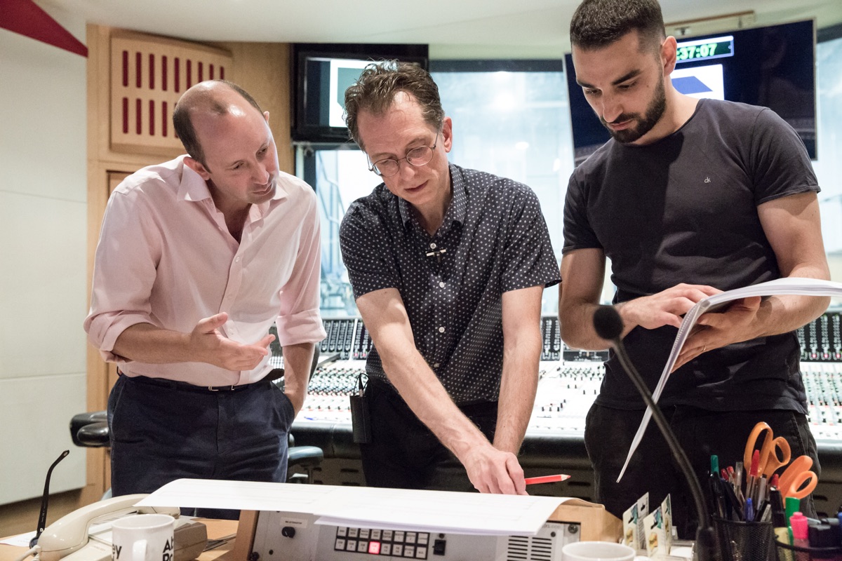 Dmitry Selipanov reviewing an orchestral score with collaborators at Abbey Road Studios