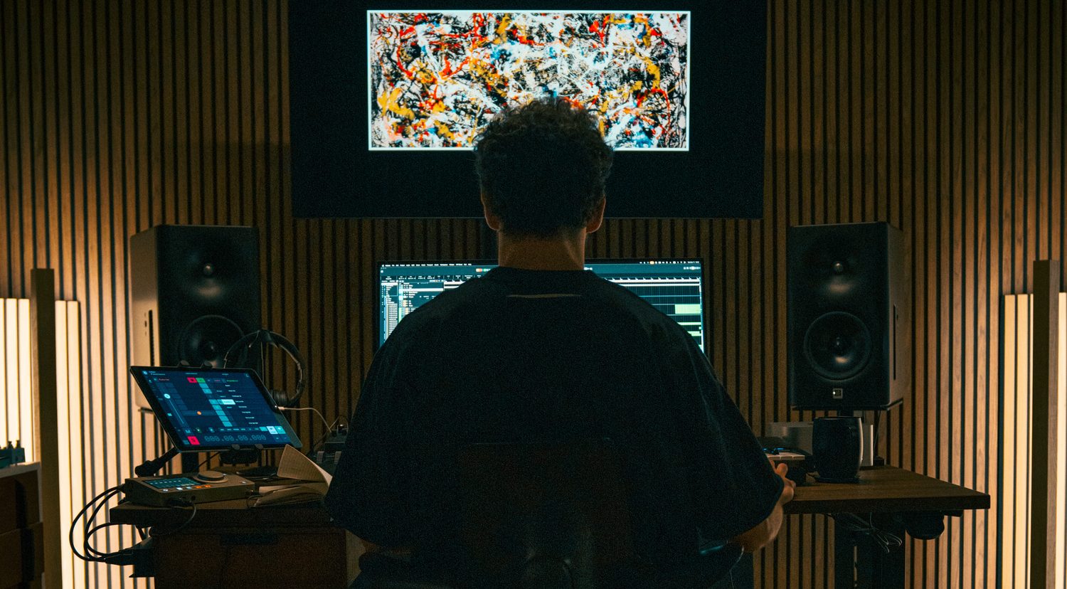 At the studio desk